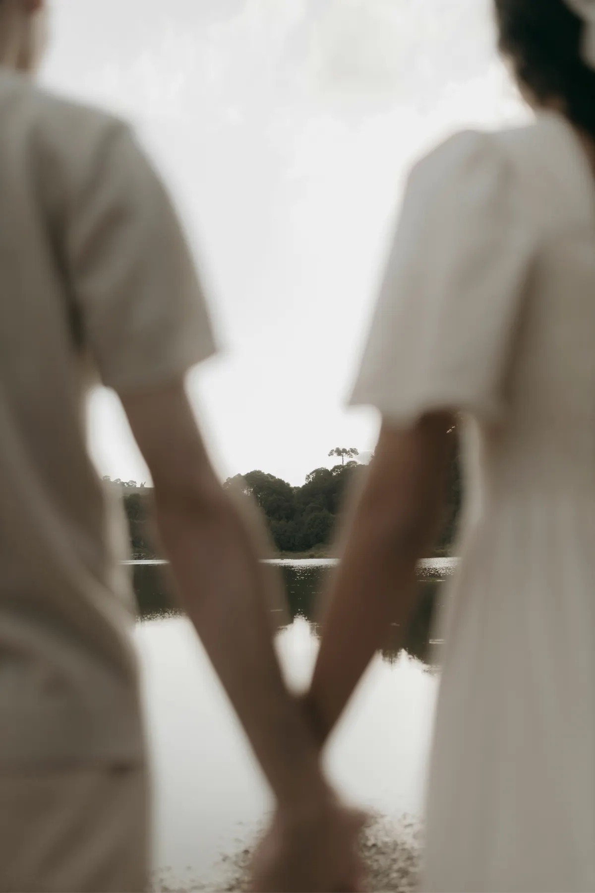 Held hands by the water